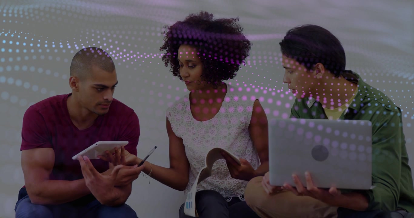 Three teammates studying center offering stylus left using tablet purple dots sweeping across scene