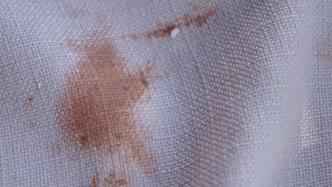 rusty stain on light beige fabric