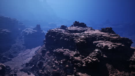 aerial view of a rugged canyon with rocky cliffs