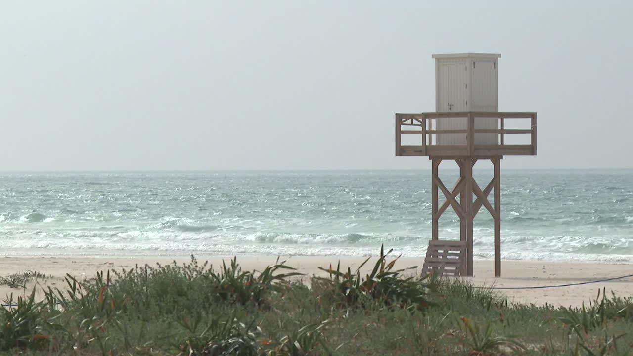 Tranquil Beach Scene with Lifeguard Tower