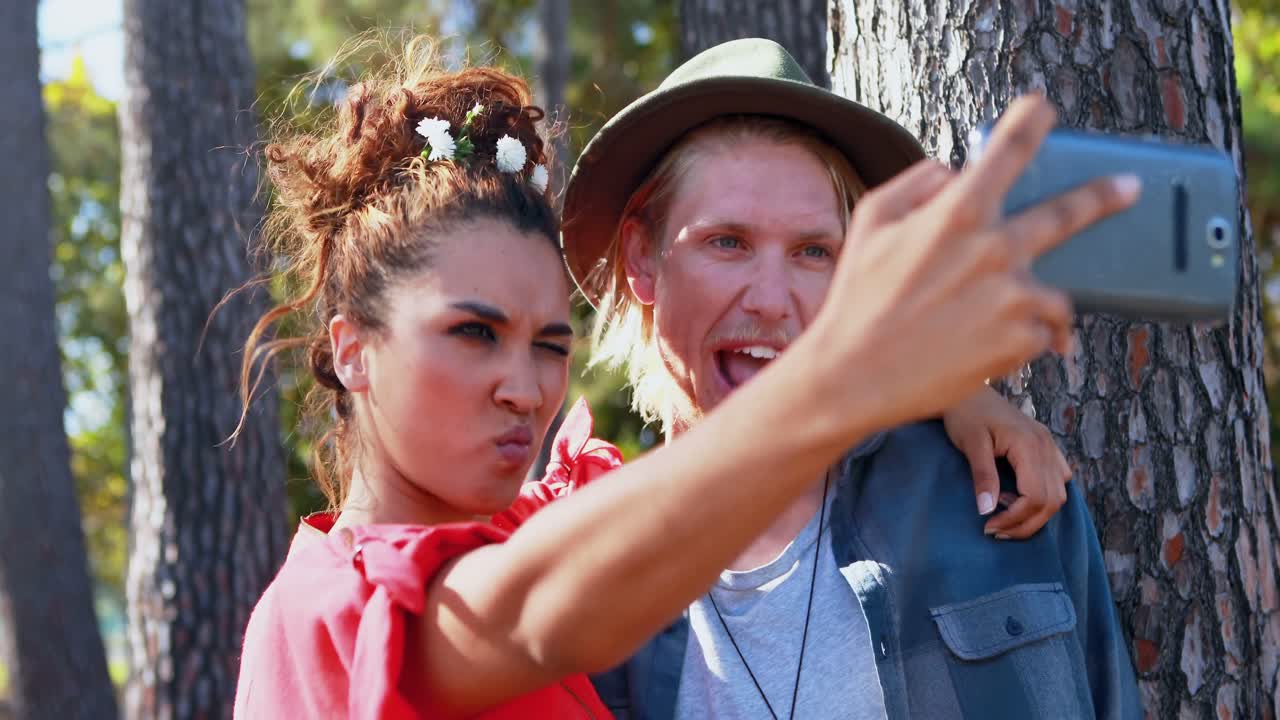 Hipster couple taking a selfie 4k