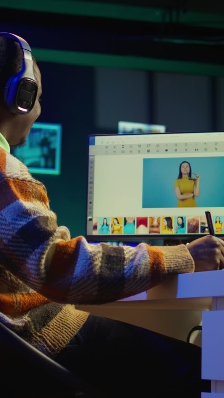 Vertical Video Artistic designer using advanced tools for photo retouching at his home office