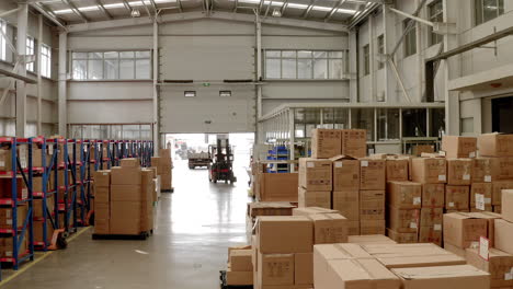 a forklift is parked between boxes at a warehouse of a chinese factory