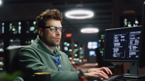 software engineer looking monitors in monitoring office closeup. analyst typing