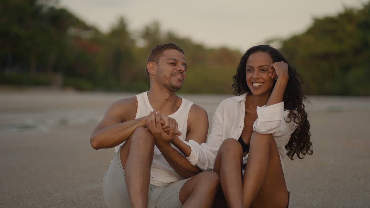 Partners talking at the beach
