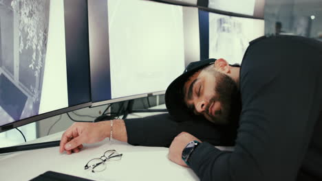 man sleeping at his desk in an office