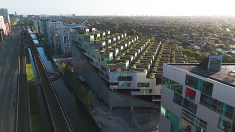 aerial view of modern apartment building with green roofs in copenhagen, denmark