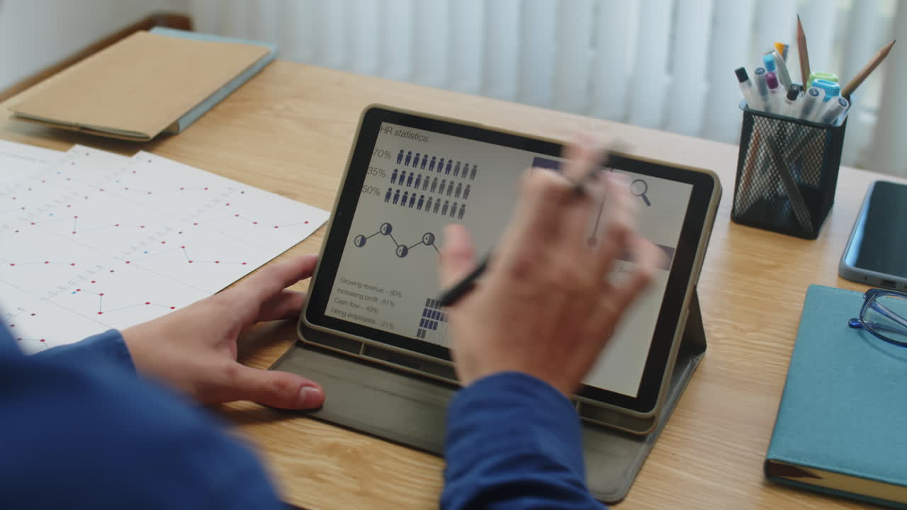 Male Entrepreneur Working on Digital Tablet