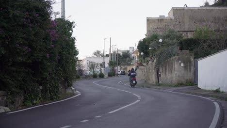 camera shot of a calm street in torregaveta, italy