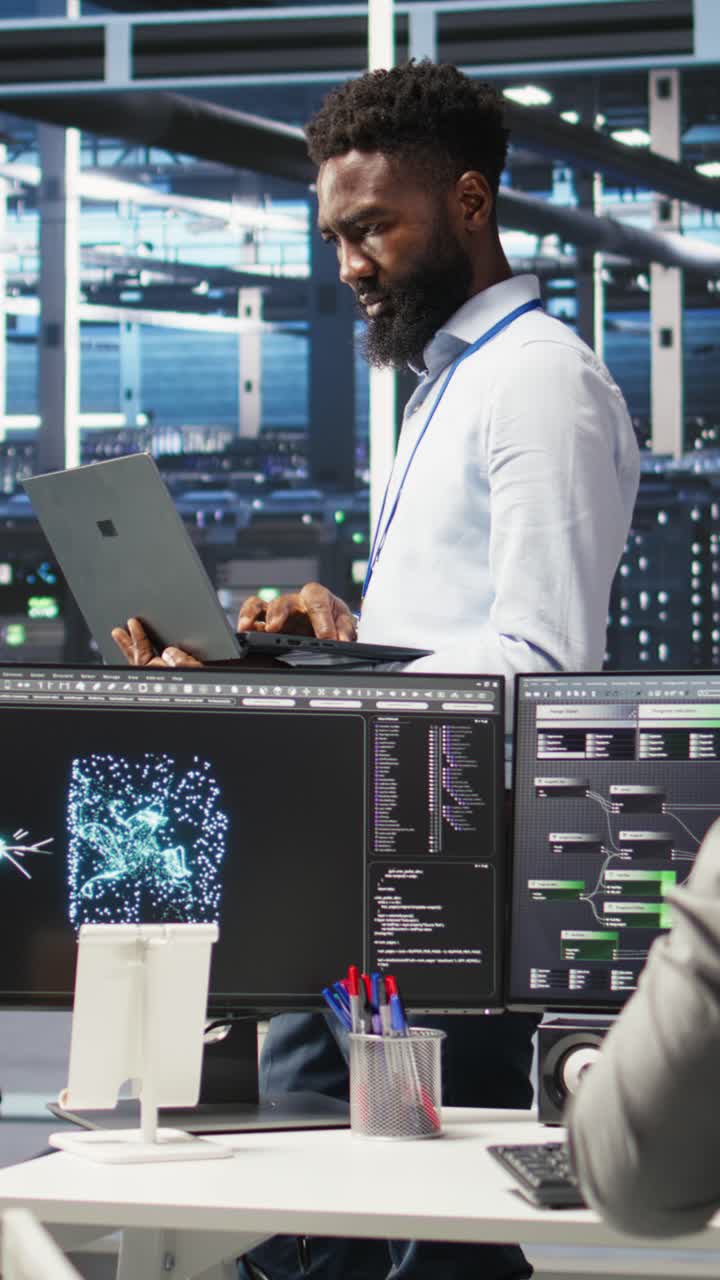 Vertical Video Portrait Of Data Center Engineer Analyzing Gear Issues Using Node Tree Tool