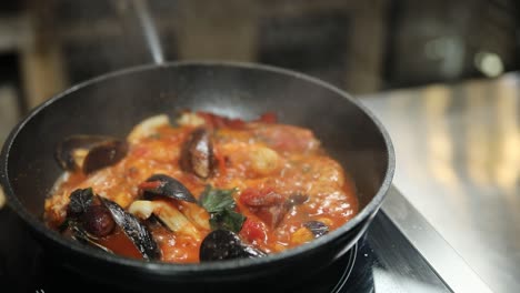 seafood pasta cooking in pan