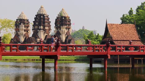 time-lapse of a bridge with temple background