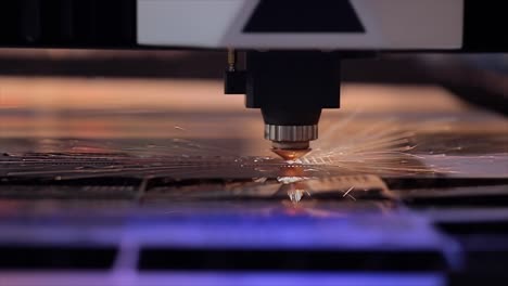 CNC-Laser-cutting-of-metal-in-slow-motion,-modern-industrial-technology.