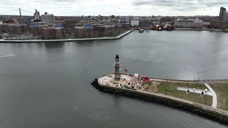 an aerial view of the roosevelt island lighthouse on a cloudy day