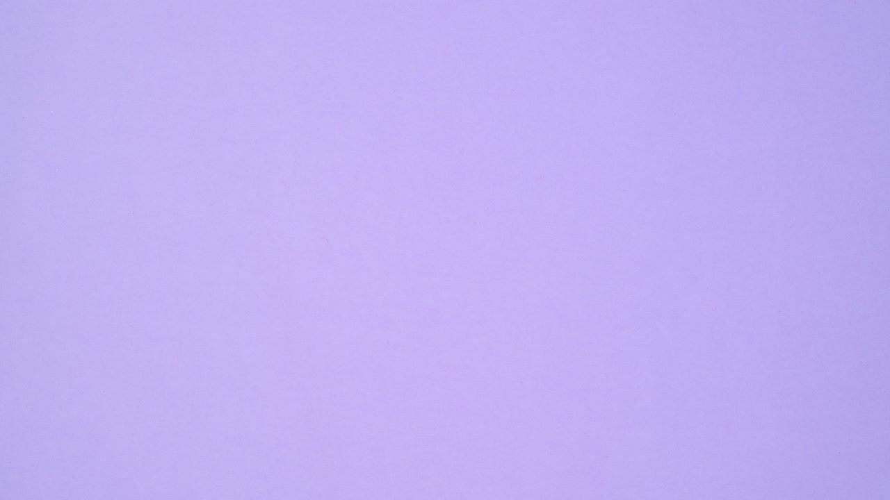 Colorful vibrant hardcover vintage books make frame on purple theme. Stop motion