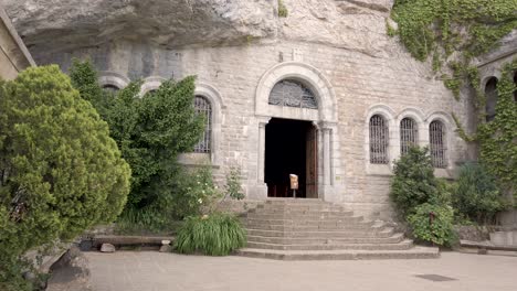 tilt shot of the mary magdalene cave entrance in the sainte baume mountain located in provence, south of france