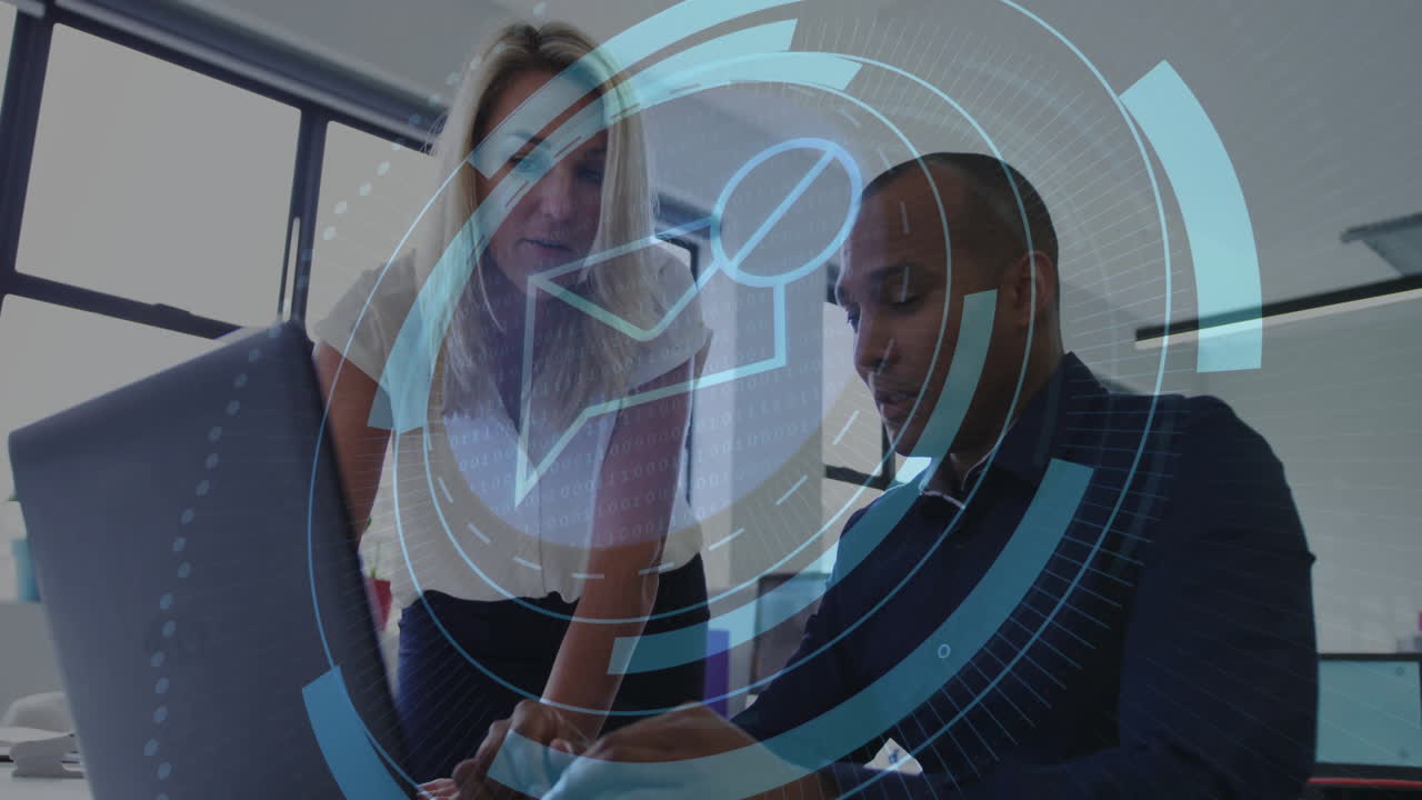 Business professionals leaning over laptop by windows, featuring animated blue circular interface