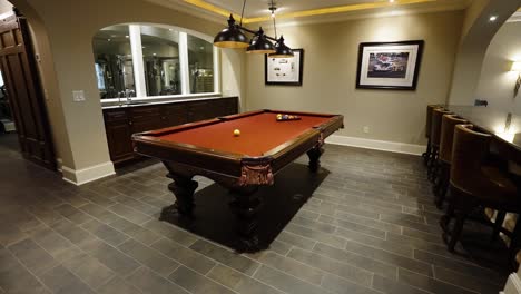 elegant home billiard room with bar area