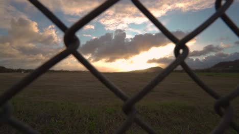 sunset with a fence foreground