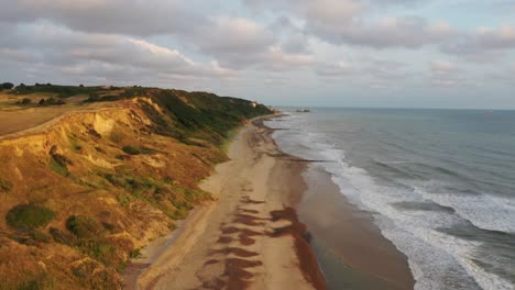 aerial flight along the cliff face between overstrained and cromer in norfolk, uk