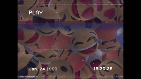 Digitale-Animation-Des-VHS-Glitch-Effekts-über-Mehreren-Gesichts-Emojis-Auf-Schwarzem-Hintergrund