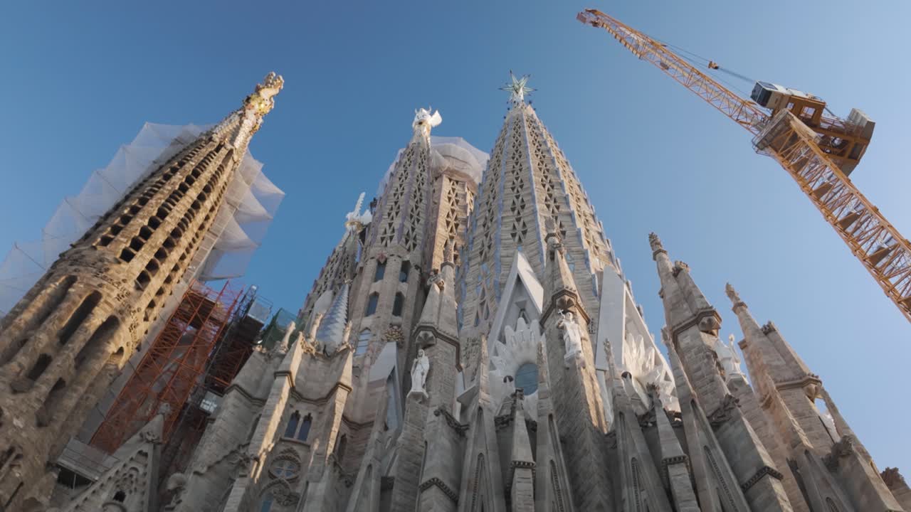 Towering spires and construction cranes at La Sagrada Familia in Barcelona Spain