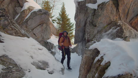 male tourist on winter hike in mountains
