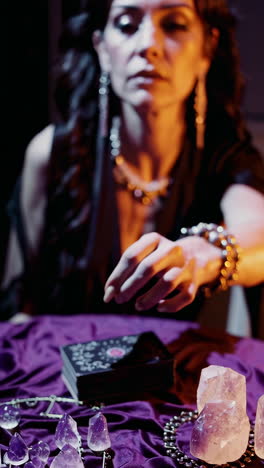 woman performing a tarot card reading