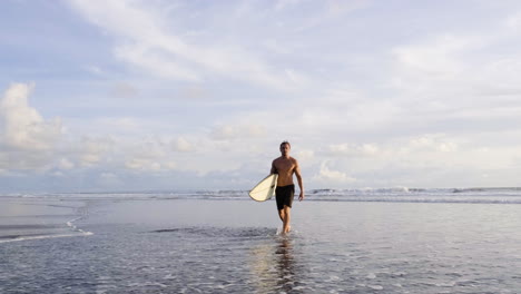 young man with surfboards