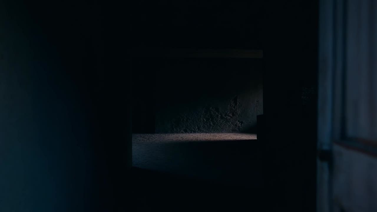 Vibrant doorway leading to dark interior. A brightly colored doorway opens to a shadowy space inside, capturing a contrast between light and darkness.