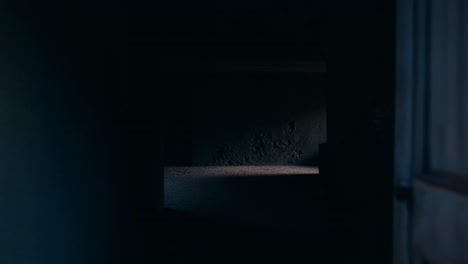 Vibrant doorway leading to dark interior. A brightly colored doorway opens to a shadowy space inside, capturing a contrast between light and darkness.