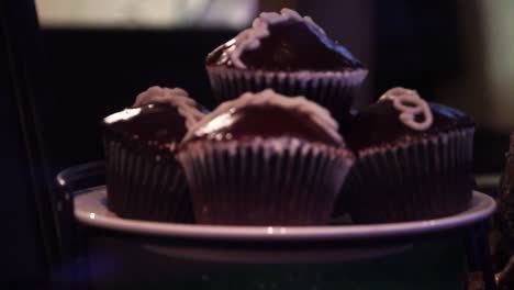 blurred chocolate cupcakes gets on focus