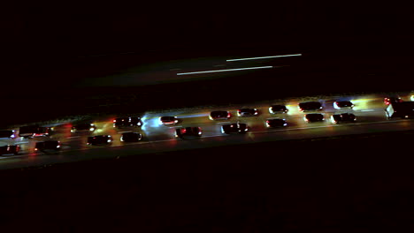 night drone hyper lapse of slow moving traffic on the interstate