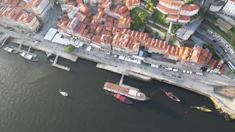 Drone-shot-looking-down-over-the-river-in-Porto-Portugal