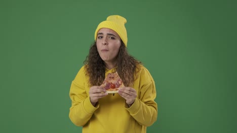 woman eating delicious slice of pizza and giving thumbs up