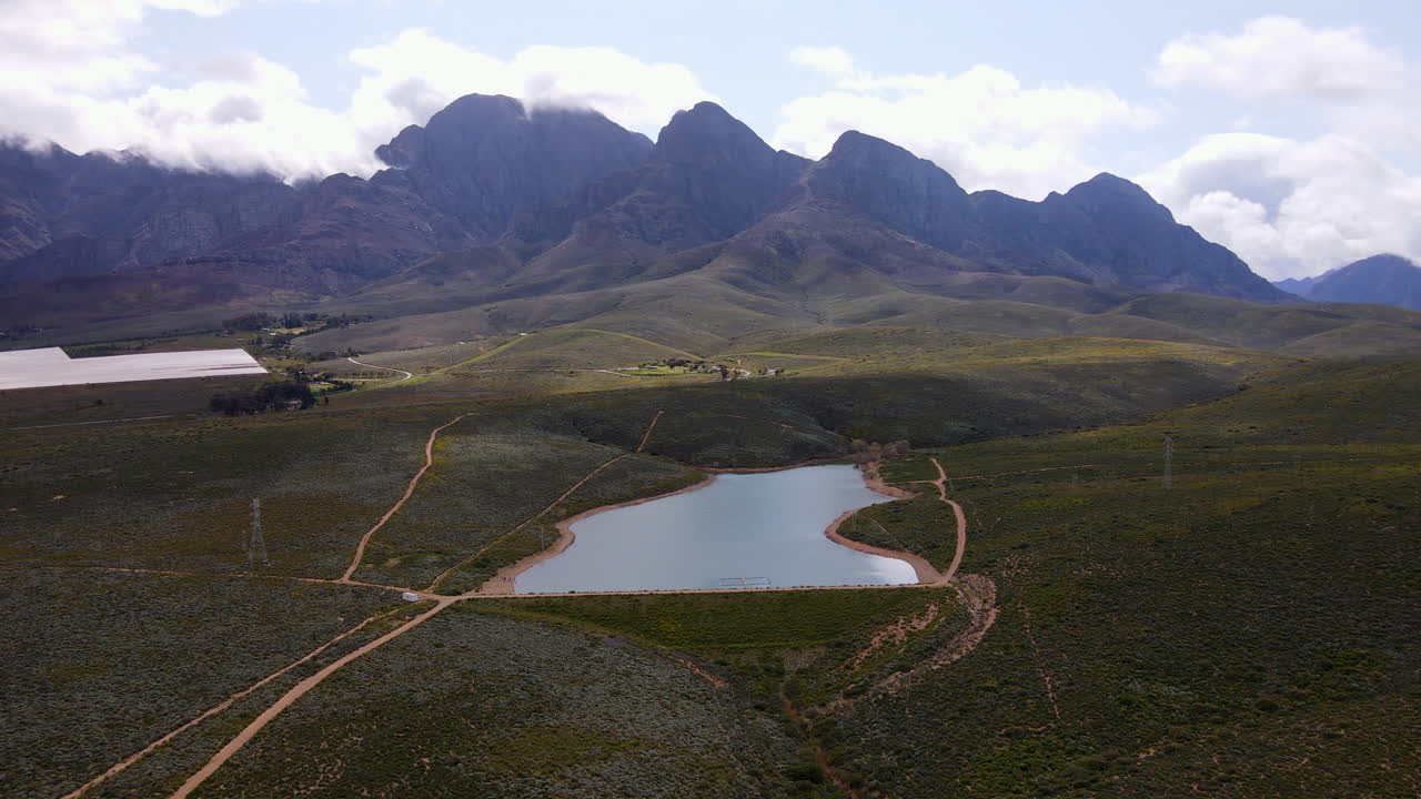 Worcester Foreldam in countryside near jagged Breede Valley mountains, aerial