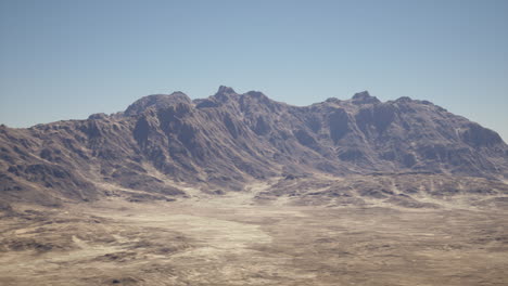 a vast mountain range in a desert landscape