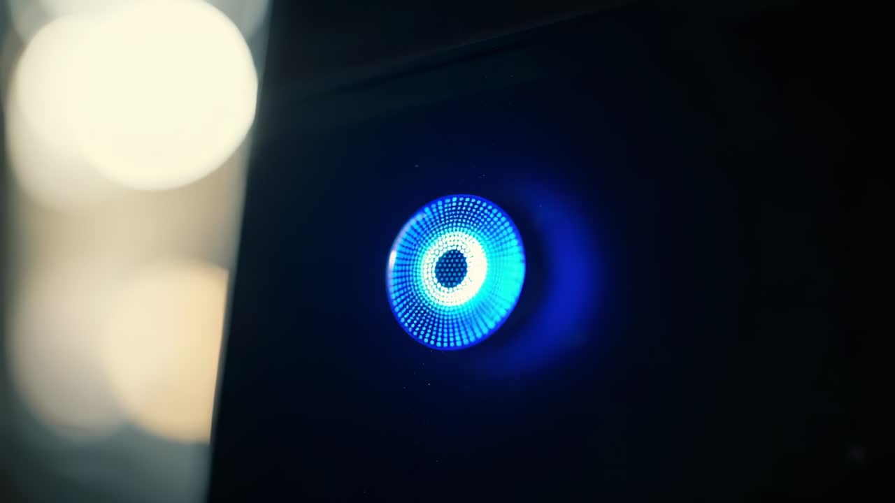 Powering perforated LED grille receiving power signal on dark panel with left bokeh, copy space