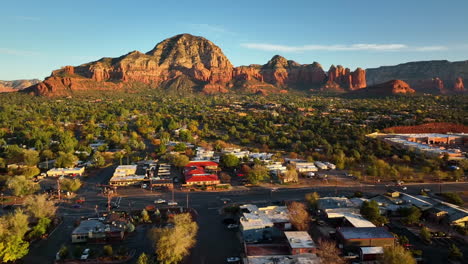 cinematic ascending drone shot of sedona arizona with the airport mesa mountain in the distance