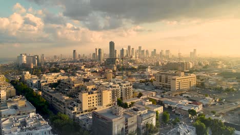 tel aviv skyline from drone. aerial shot long super wide horizon view. daytime sunset or early morning color sky coastline and office building in a modern tel aviv