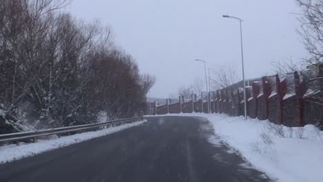 driving on asphalt road in istanbul, turkey during snowfall in winter