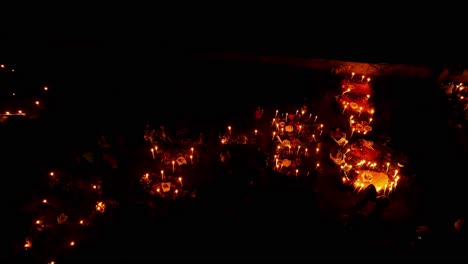 drone : dolly in of a graveyard in janitzio island in patzcuaro michoacan at day of the death
