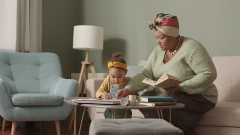 aged woman helping school kid doing homework
