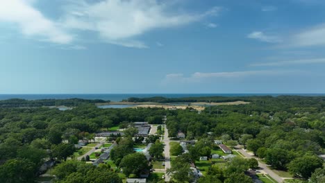 Lakeside-neighborhood-in-summer-as-seen-from-the-air