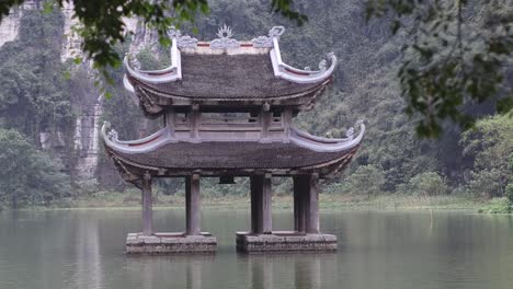 static view of an asian-style pagoda over water