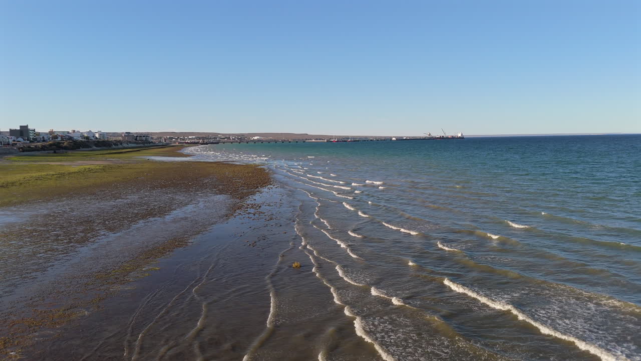 Drone view over the sea on the beach of Puerto Madryn.