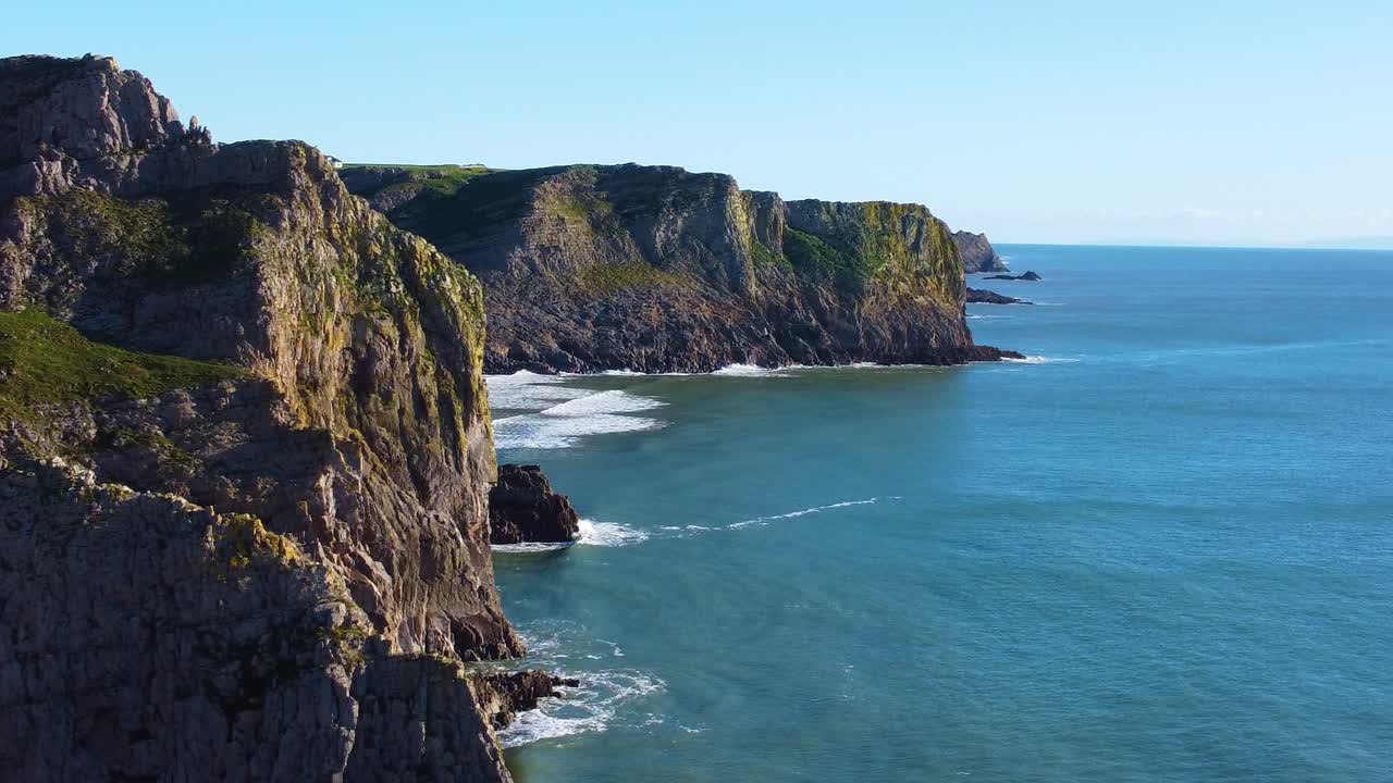 Sideways Parallax Opening Establishing View of Rugged South Wales UK Coastline. Travel Nature Drone Clip. Beautiful Welsh Gower Peninsula Coast