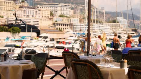 luxury cars passing by a marina restaurant