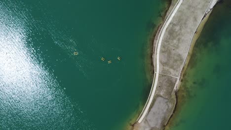 Descending-aerial-shot-of-shore-in-lake-Plastira-in-Greece