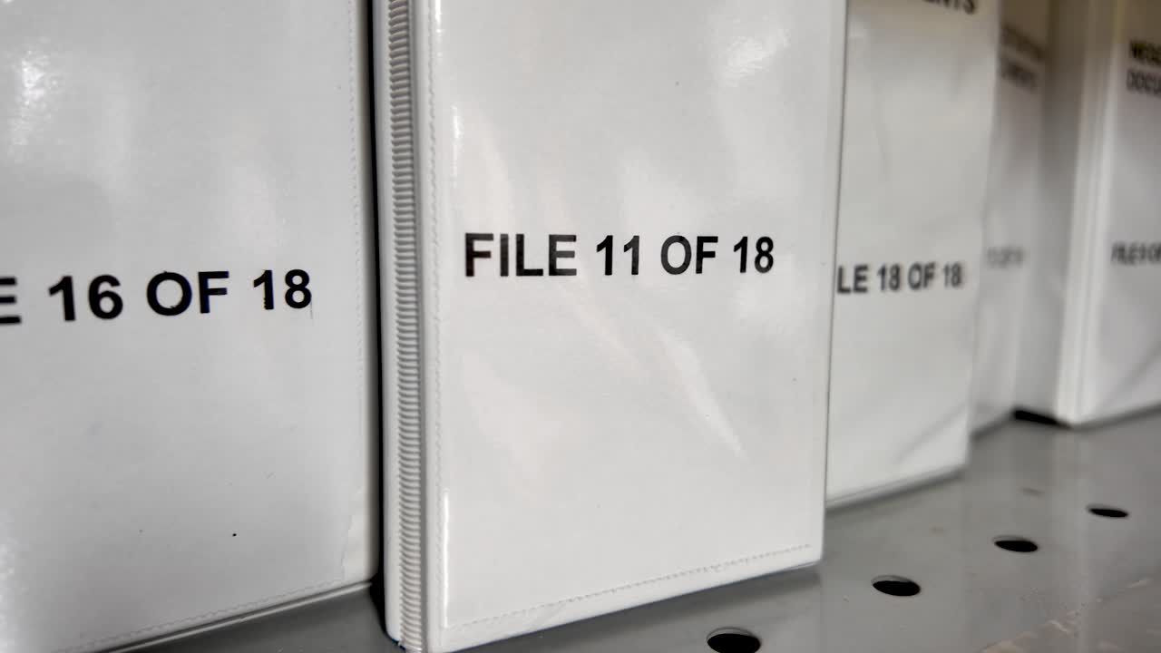 Data Management And Compliance Close Up Of File Folders On Shelf In Office Basement Records Organization And Information Governance For Regulatory Requirements